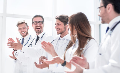 group of successful doctors applauds