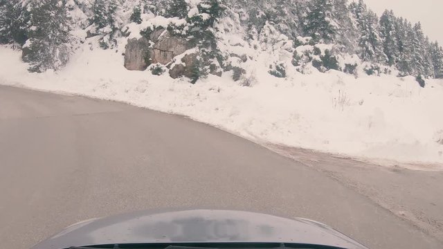 Driving on a snowy mountain road to Ziria ski center in Greece.