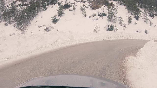 Driving on a snowy mountain road to Ziria ski center in Greece.