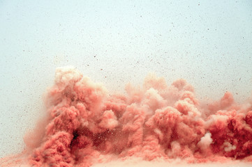 Flying rocks and dust clouds after detonator blast in the desert