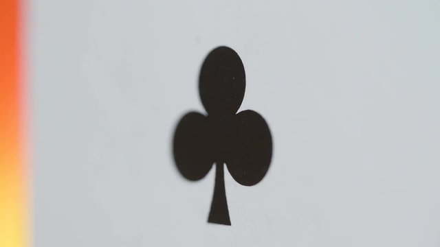 22121_A_small_black_club_on_a_macro_shot_of_the_card.mov