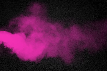 Pink powder explosion on black background. black mortar cement abstract background texture wallpaper