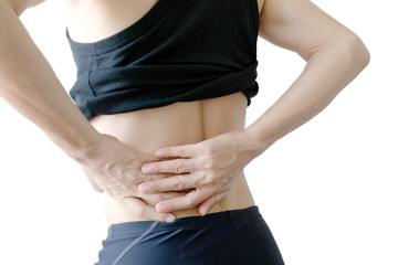 Woman's hand She is caught at the waist and her back is painful at the back in the park. Cause of the exercise.