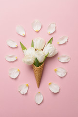 Obraz na płótnie Canvas Flat-lay waffle cone with white flower blossom