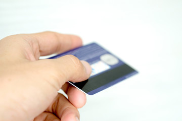 Hand of woman holds her credit card bank pay to shop for her credit card.