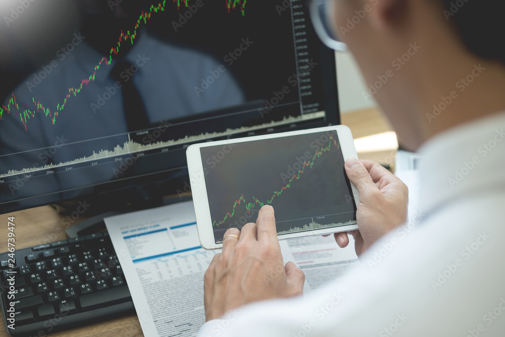 Poster stock exchange trader analyzing graphs chart or data on multiple screens in office.