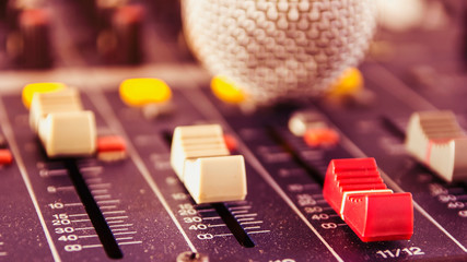 Slide the button to adjust the volume mixer of audio professionals. In the studio recording.