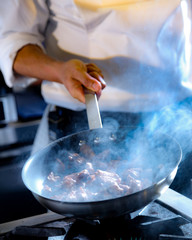 Chef cooking food in the kitchen, Chef preparing food, food frying in wok pan