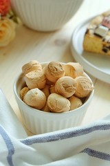 Close up of Thai mini cookies. Thai call "Khanom Ping" A type of traditional Thai dessert consisting of many small, often brightly color, cookies made from flour and coconut.