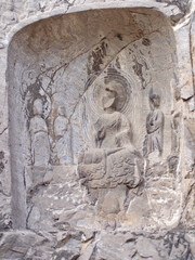 Luoyang Longmen grottoes. Broken Buddha and the stone caves and sculptures in the Longmen Grottoes in Luoyang, China. Taken in 14th October 2018