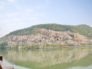 Luoyang Longmen grottoes. Broken Buddha and the stone caves and sculptures in the Longmen Grottoes in Luoyang, China. Taken in 14th October 2018