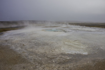 Hot steam coming from the boiling water in the central Iceland in the geothermal area of Hveravellir.