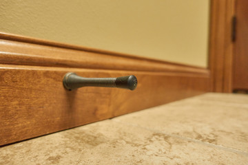 Isolated door stop spring mounted on trim
