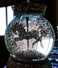 Snow globe with horse carousel