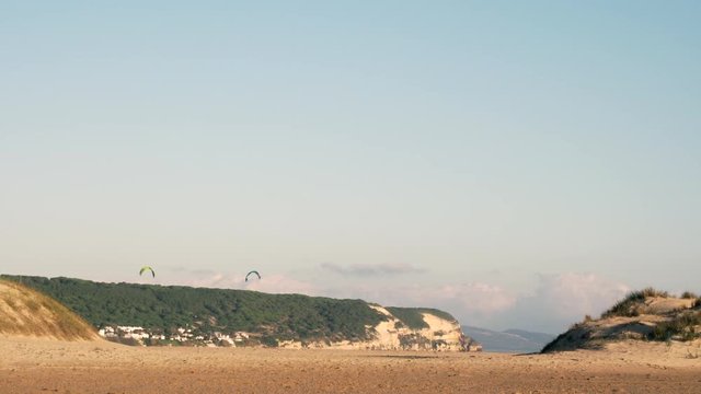 People doing kitesurf on the spanish coast of Cadiz.