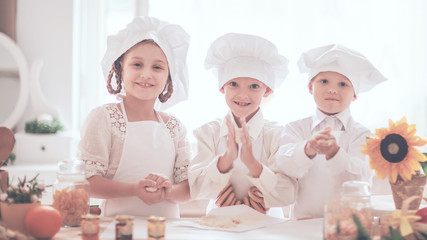 happy little children in the form of a chef to prepare delicious meals