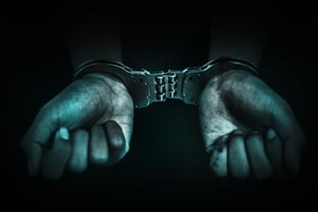 Obraz premium Business Man's hand in handcuff, crime arrested concept