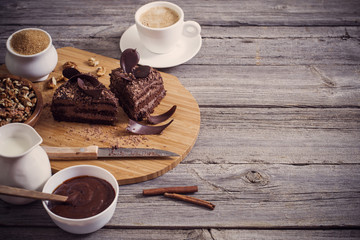 Chocolate cake on old wooden table