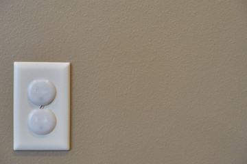 Child proofed covered electrical outlet
