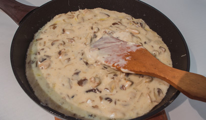  Cooking beef stroganoff in a pan.  Fresh veal, cooked at home.