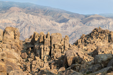 Rock formations with mountains in the Alabama Hills near Lone Pine, California, USA