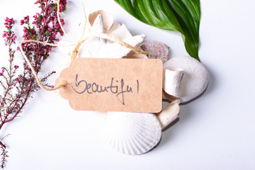 A collection of wellness items and a heart built out of branches and a tag saying "beautiful"