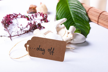 A collection of wellness items and a heart built out of branches and a tag saying "day off"