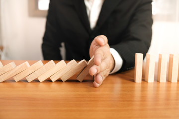 Planning risk and strategy in businessman gambling placing wooden block.Business concept for growth...