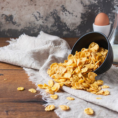 Сornflakes on wooden table at morning. The concept of diet, proper nutrition and a healthy lifestyle. Selective focus.