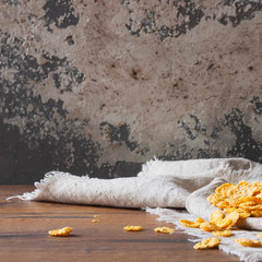 Сornflakes on wooden table at morning. The concept of diet, proper nutrition and a healthy lifestyle. Selective focus.