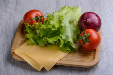 vegetables and cheese on wooden dishes