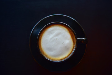 Coffee in a black cup