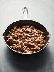browned ground beef in cast iron skillet