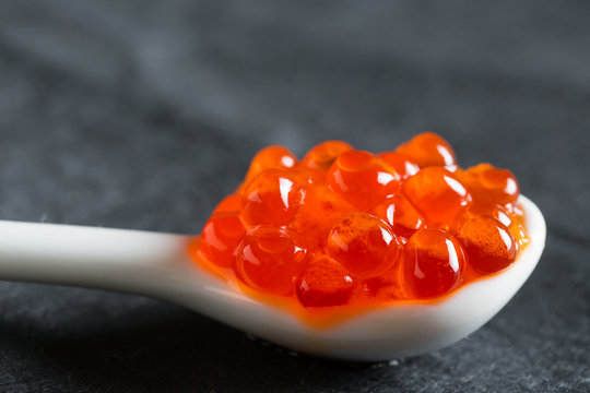 Red salted caviar on a spoon