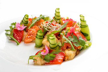 Bright vegetable salad with tofu and rice chips.