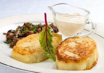 Potato zrazy with a meat filling on a white plate. Traditional Ukrainian zrazy recipe