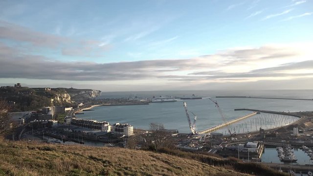 UK January 2019 - A DFDS ferry enters Dover port in the early morning seen from a high on a hill overlooking the town.