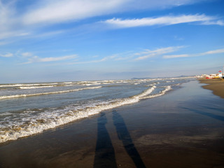 Surf line on sandy beach, Rimini, Italy,  Europe, Adriatic sea.