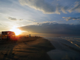 Fototapeta na wymiar Stunning sunset on a sandy beach, Rimini, Italy, Adriatic sea, Europe.