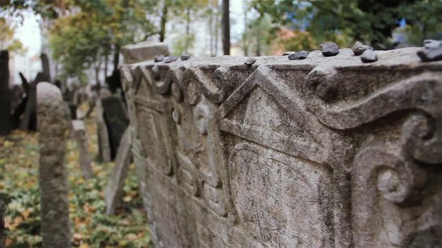 Thousands of Gravestones are crammed in the Old Jewish Cemetery, Prague, Czech Republic. Close Up.