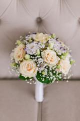 wedding bridal bouquet on the couch
