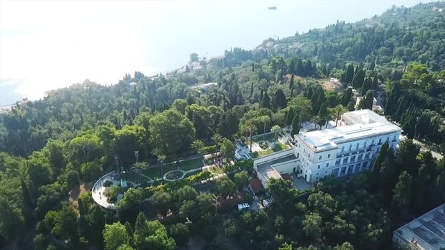 Aerial drone video of iconic Palace of Achileion former residence Empress Elisabeth of Austria (known as 'Sissi') and Kaiser William II of Germany, Corfu, Greece