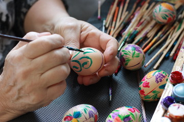 handmade painted easter eggs hands of a woman