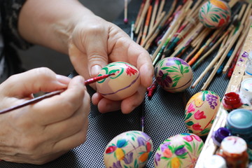 handmade painted easter eggs hands of a woman