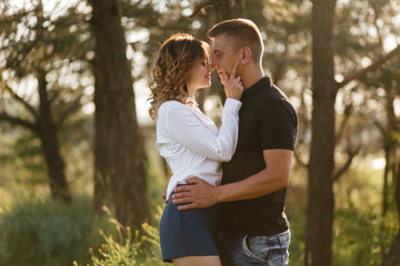 Fototapeta premium Portrait of a happy young couple enjoying a day in the park together