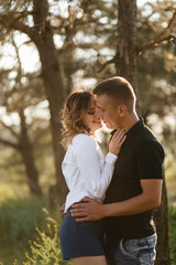 Fototapeta premium Portrait of a happy young couple enjoying a day in the park together