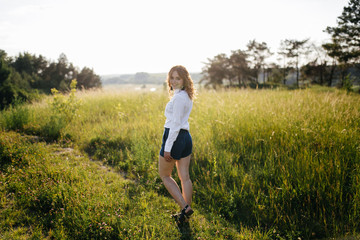 A girl in a hat on a walk in the park