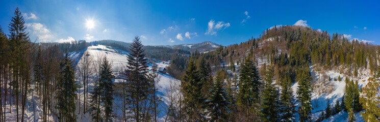 Panoramic view of the winter mountains. View from above. Landscape photo captured with drone. Silesian Beskids, Poland, Europe.