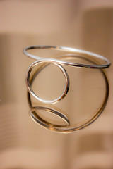  silver metal bracelet in reflection