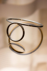  silver metal bracelet in reflection